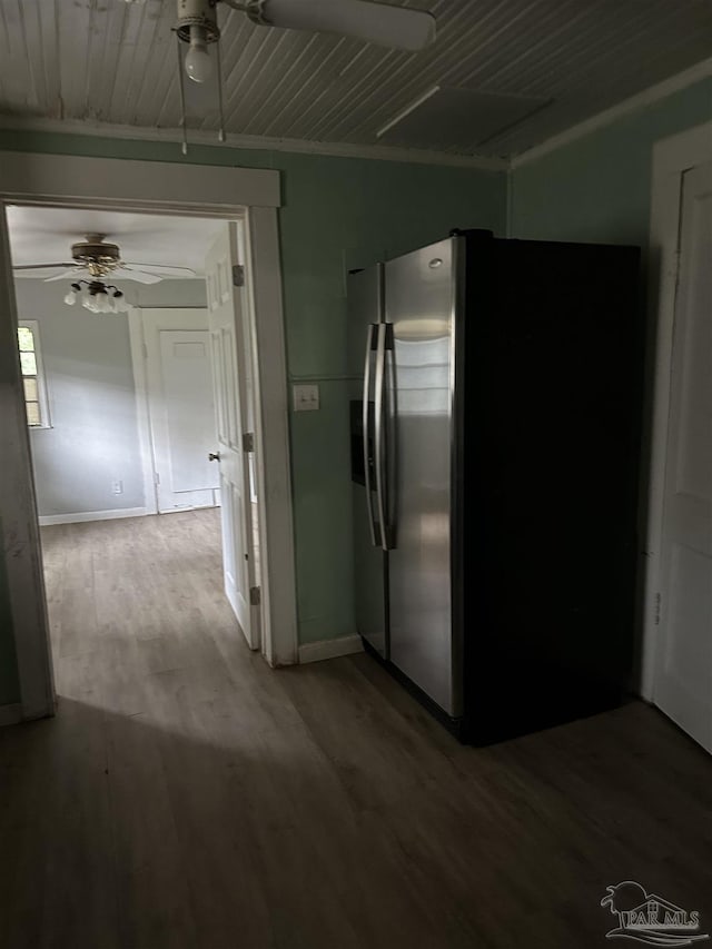 hallway with hardwood / wood-style flooring and ornamental molding