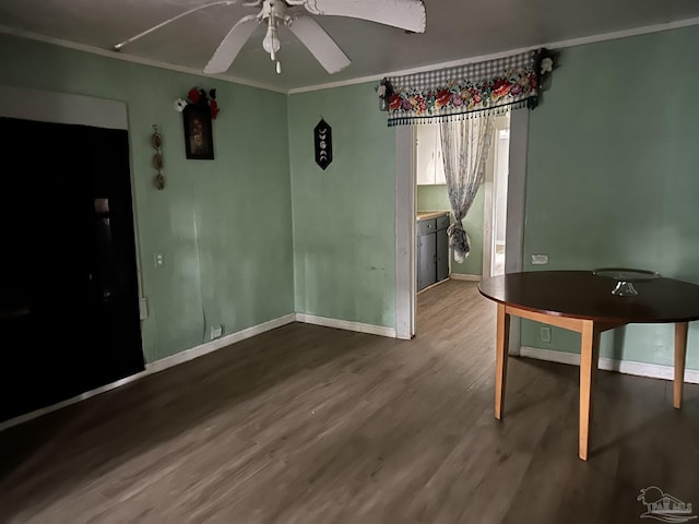 unfurnished dining area featuring hardwood / wood-style flooring, ceiling fan, and ornamental molding