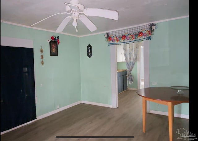 interior space with hardwood / wood-style flooring, ornamental molding, and ceiling fan