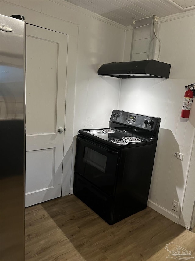 kitchen with black / electric stove, crown molding, wood-type flooring, and exhaust hood