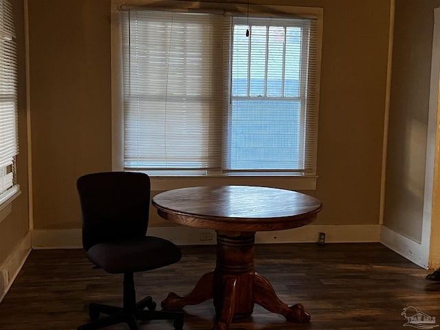 dining space with dark wood-type flooring