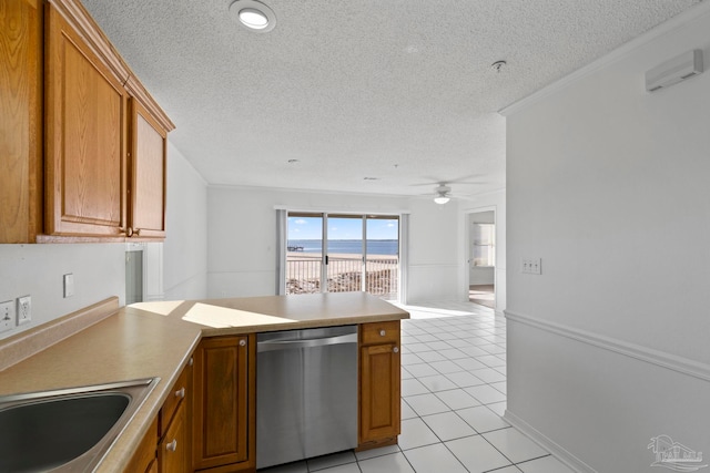 kitchen with sink, ceiling fan, a textured ceiling, light tile patterned floors, and dishwasher