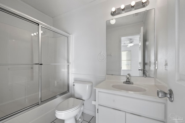 full bathroom with toilet, tile patterned flooring, combined bath / shower with glass door, vanity, and crown molding