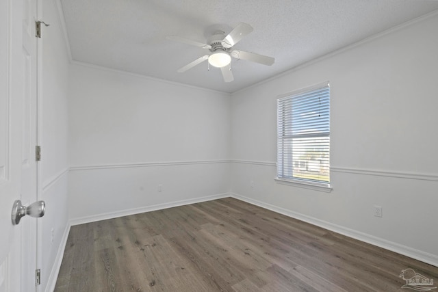 spare room featuring ornamental molding, a textured ceiling, dark hardwood / wood-style floors, and ceiling fan