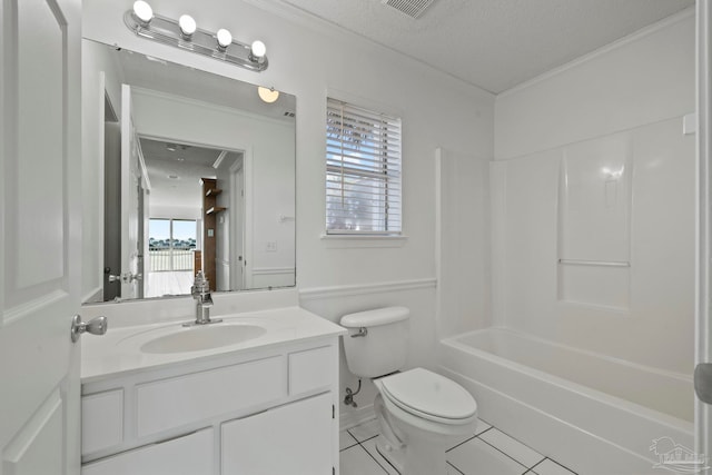 full bathroom featuring toilet, tile patterned flooring, a textured ceiling, vanity, and bathing tub / shower combination