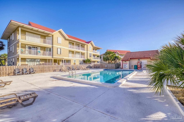 view of swimming pool with a patio area