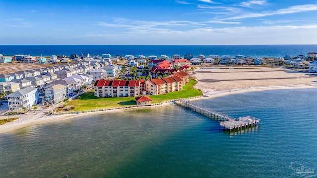 bird's eye view featuring a view of the beach and a water view