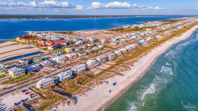 aerial view featuring a view of the beach and a water view