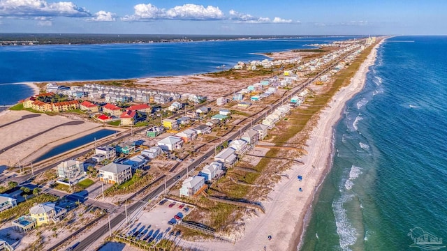 birds eye view of property with a beach view and a water view