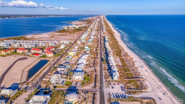 bird's eye view featuring a view of the beach and a water view