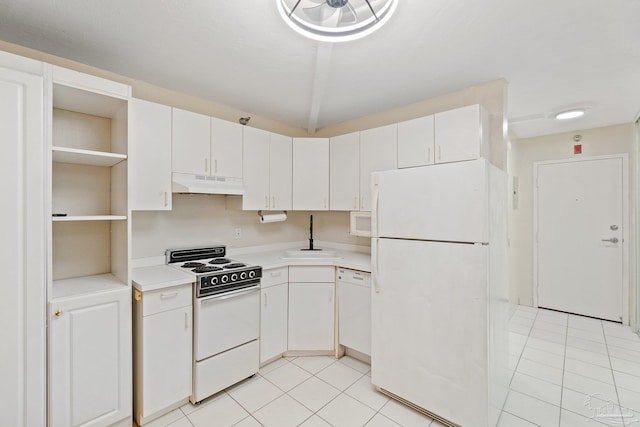 kitchen with sink, light tile patterned flooring, white cabinetry, and white appliances