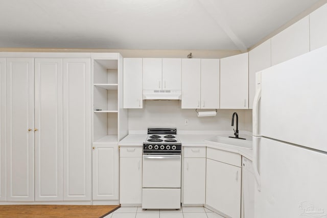 kitchen featuring sink, white appliances, light tile patterned floors, and white cabinetry