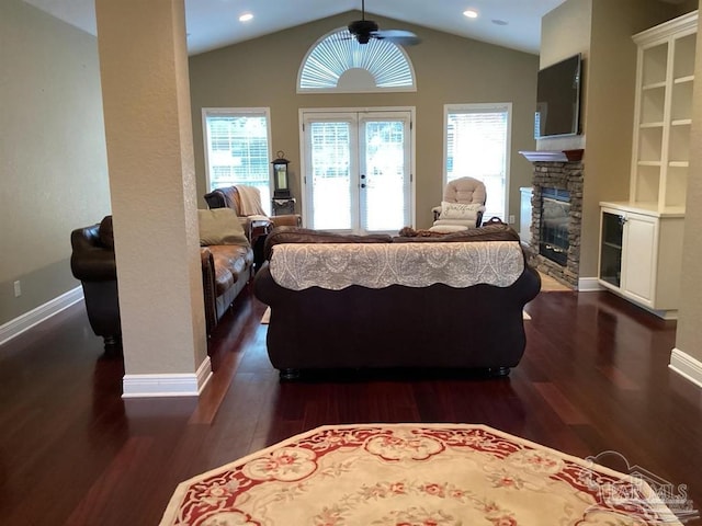 bedroom featuring dark wood-type flooring, access to outside, and multiple windows