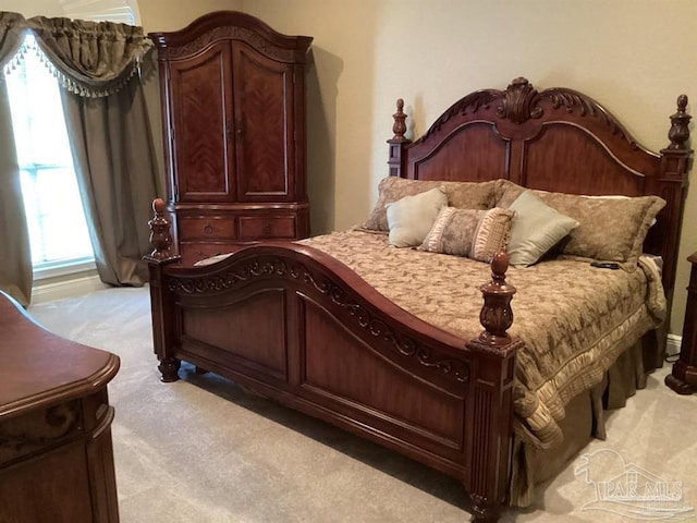 bedroom with light carpet