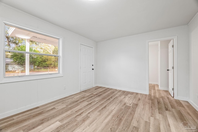 unfurnished room with light hardwood / wood-style floors