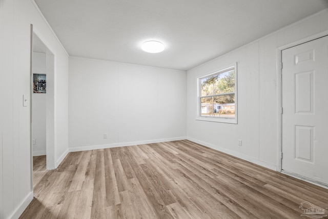 spare room featuring light hardwood / wood-style flooring