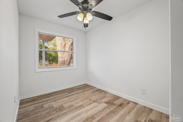 spare room featuring ceiling fan and light hardwood / wood-style flooring