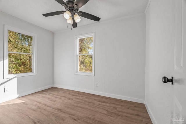 unfurnished room featuring hardwood / wood-style flooring and ceiling fan