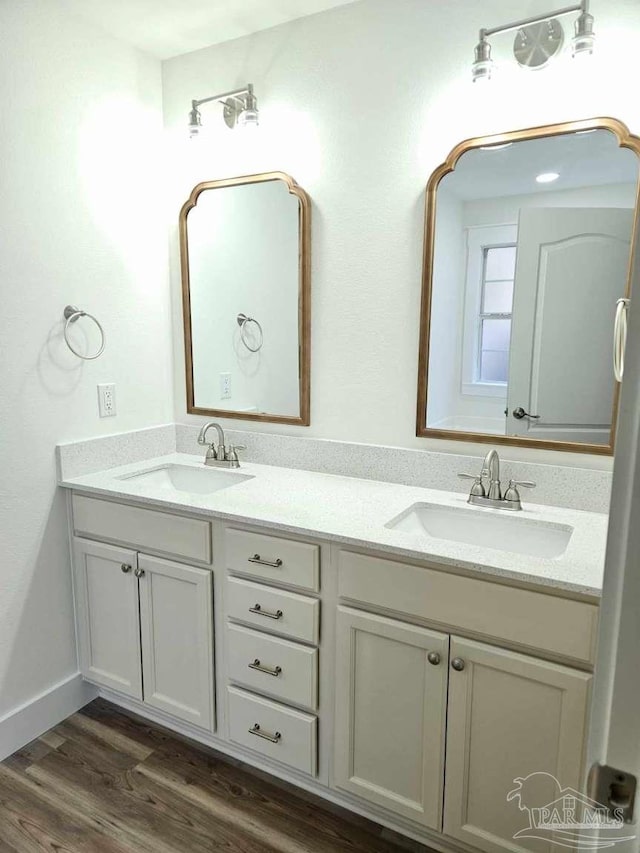 bathroom featuring vanity and hardwood / wood-style floors