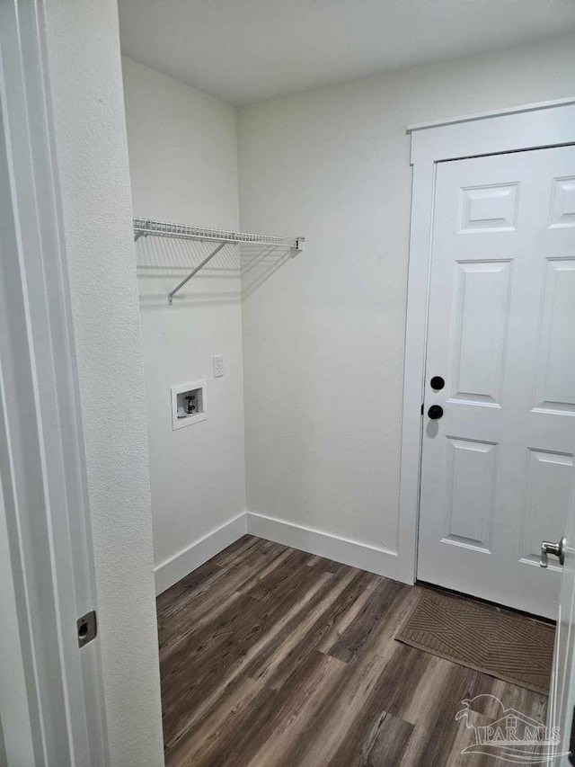 washroom featuring dark hardwood / wood-style floors and washer hookup