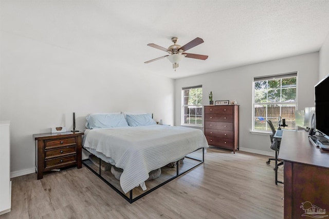6439 Dallas Ave, Pensacola, FL 32526 - bedroom featuring baseboards, multiple windows, and light wood-style floors