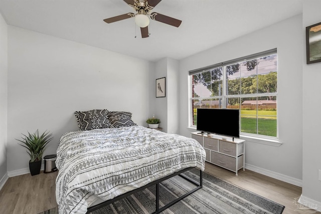 6439 Dallas Ave, Pensacola, FL 32526 - bedroom featuring baseboards, multiple windows, and wood finished floors