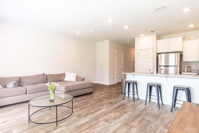 living room with light hardwood / wood-style floors