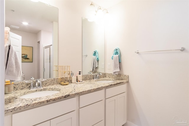 bathroom featuring dual bowl vanity