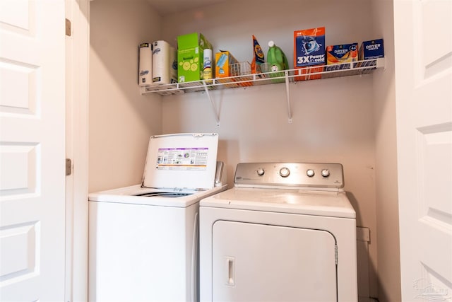 clothes washing area featuring washing machine and clothes dryer