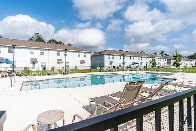 view of pool featuring a patio