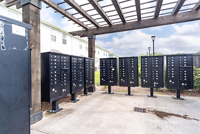 view of community with a pergola and mail boxes