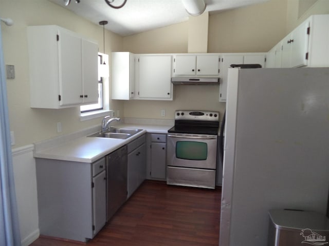 kitchen with appliances with stainless steel finishes, white cabinetry, hanging light fixtures, and sink