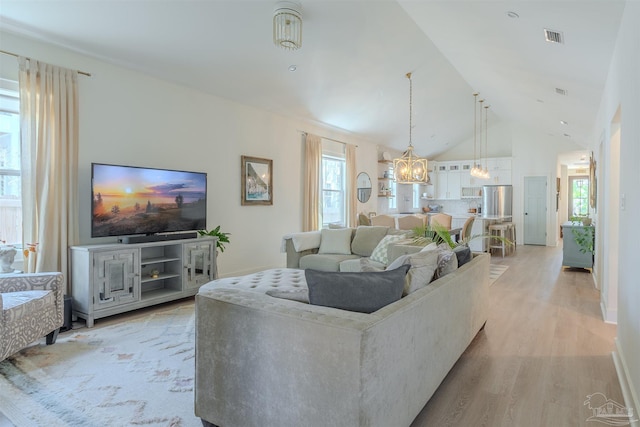 920 W Chase St, Pensacola, FL 32502 - living room with high vaulted ceiling and light hardwood / wood-style floors