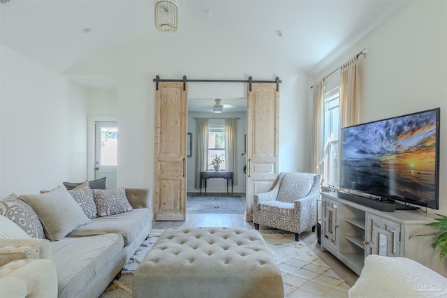 920 W Chase St, Pensacola, FL 32502 - living room with a barn door, light wood-type flooring, and high vaulted ceiling