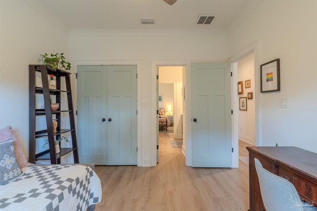 920 W Chase St, Pensacola, FL 32502 - bedroom with crown molding, a closet, and light hardwood / wood-style flooring