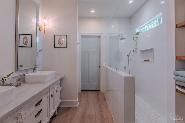 920 W Chase St, Pensacola, FL 32502 - bathroom featuring vanity, hardwood / wood-style floors, and walk in shower