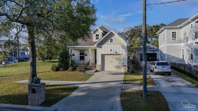 920 W Chase St, Pensacola, FL 32502 - view of front facade featuring a garage and a front yard
