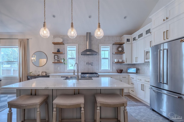 920 W Chase St, Pensacola, FL 32502 - kitchen featuring light stone counters, white cabinets, stainless steel appliances, and wall chimney exhaust hood