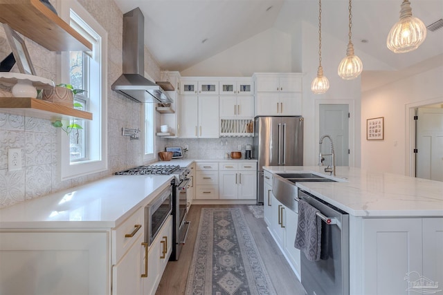 920 W Chase St, Pensacola, FL 32502 - kitchen with sink, high end appliances, light stone counters, white cabinets, and wall chimney exhaust hood