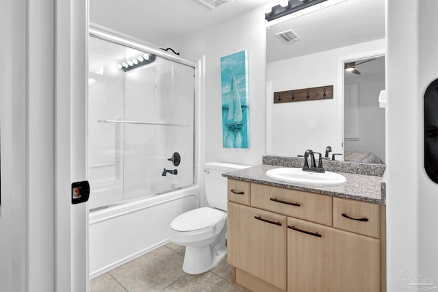 full bathroom featuring toilet, visible vents, vanity, combined bath / shower with glass door, and tile patterned floors