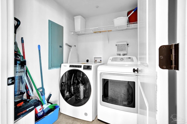 washroom with laundry area, electric panel, and washing machine and clothes dryer