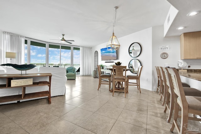 dining room with recessed lighting, visible vents, a ceiling fan, light tile patterned flooring, and a wall of windows