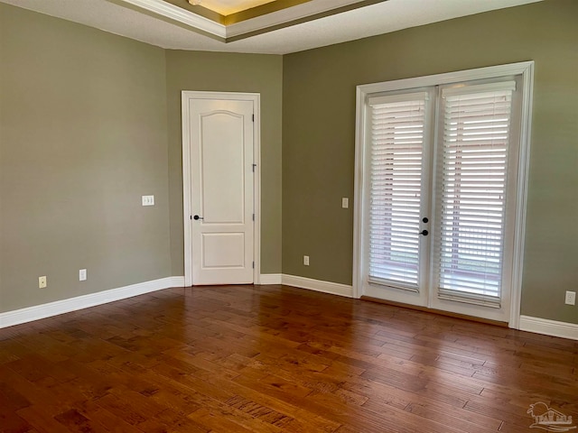 unfurnished room featuring dark wood-type flooring