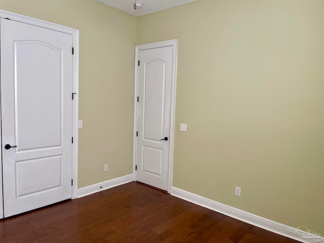 spare room featuring dark hardwood / wood-style floors