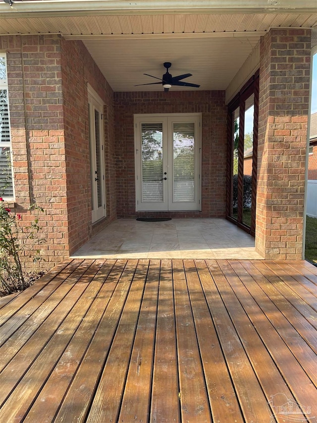 deck with french doors and ceiling fan