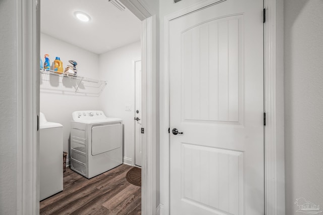 laundry room featuring visible vents, laundry area, and dark wood-style floors