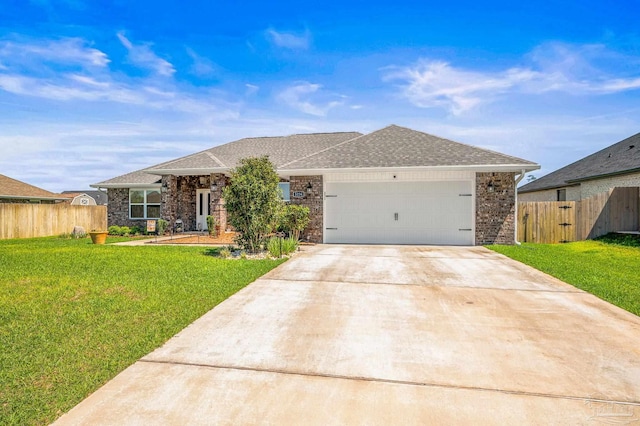 view of front facade featuring an attached garage, concrete driveway, a front yard, and fence