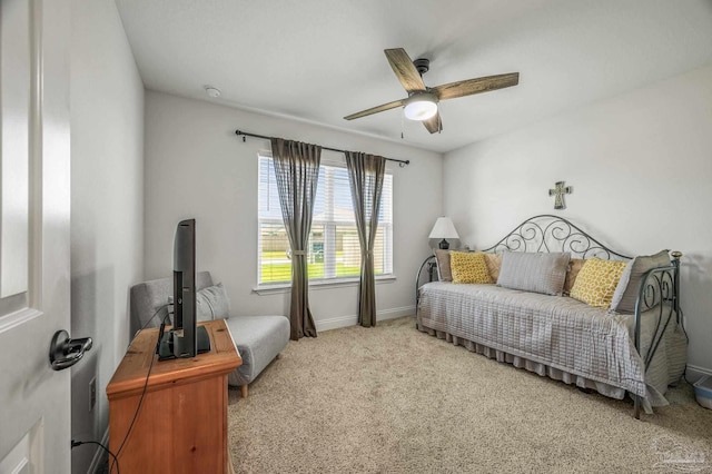 bedroom featuring baseboards, a ceiling fan, and carpet