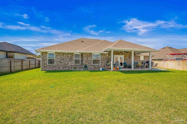 back of house with a patio area, brick siding, a fenced backyard, ceiling fan, and a yard
