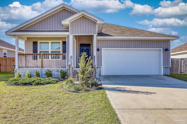 single story home featuring a garage, covered porch, driveway, and fence